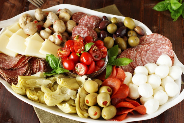 Antipasto Platter with Grape Tomato & Caper Salad from https://www.thekitchenismyplayground.com/
