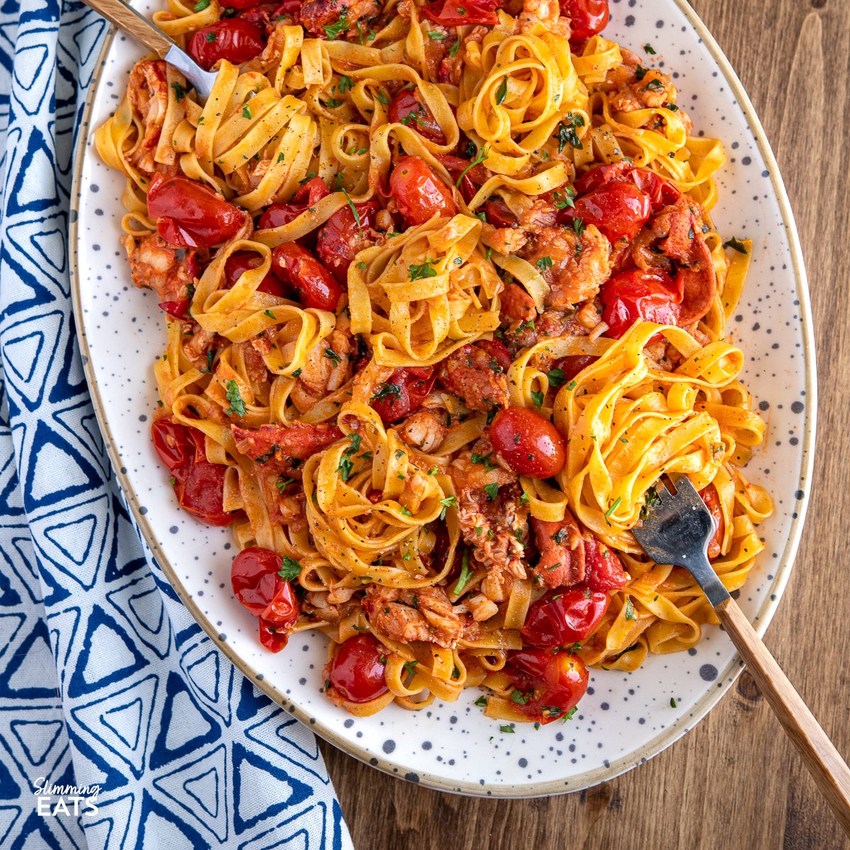 Buttery Lobster Pasta with Fresh Grape Tomatoes from https://www.slimmingeats.com/