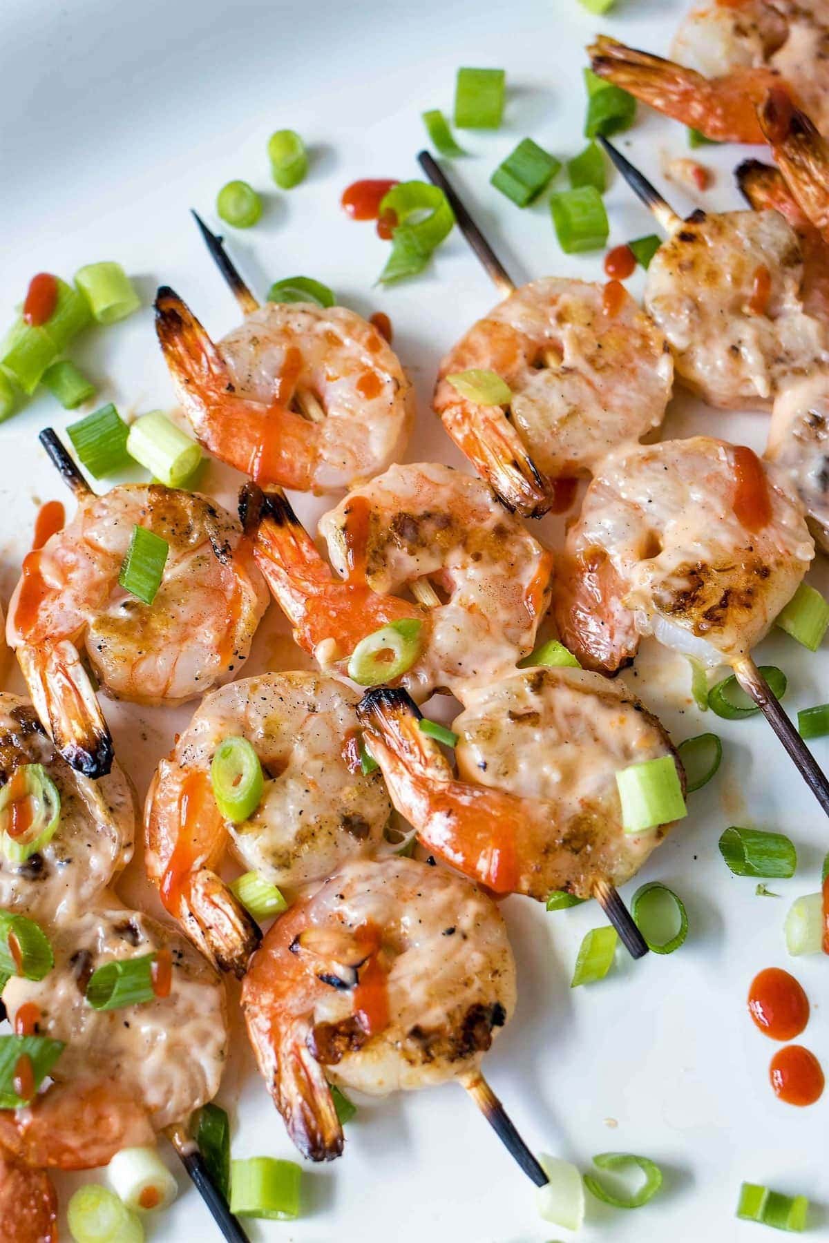 Grilled Bang Bang Shrimp Skewers from https://www.julieseatsandtreats.com/
