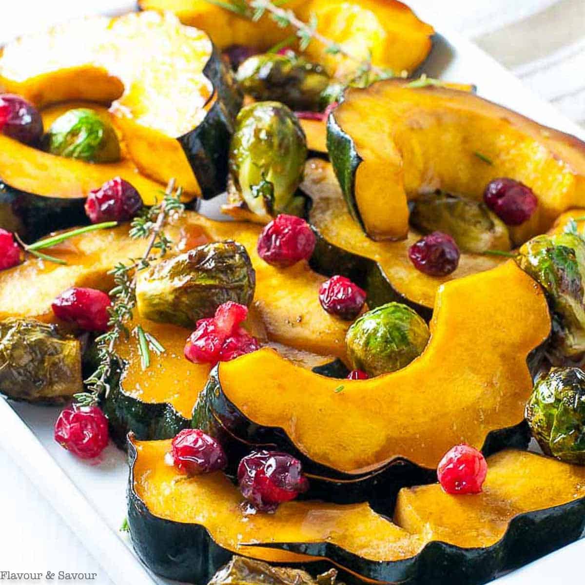 Honey Balsamic Roasted Acorn Squash and Brussels Sprouts from https://www.flavourandsavour.com/