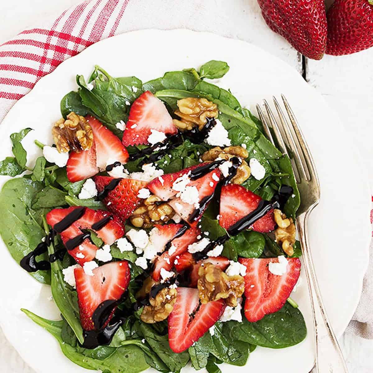 Spinach Strawberry and Goat Cheese Salad from https://www.seasonsandsuppers.ca/